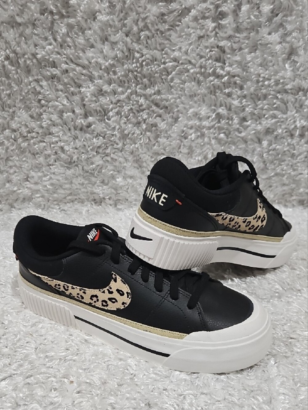 Nike Women’s Black Platform Sneakers with Leopard Swoosh and Gold Trim